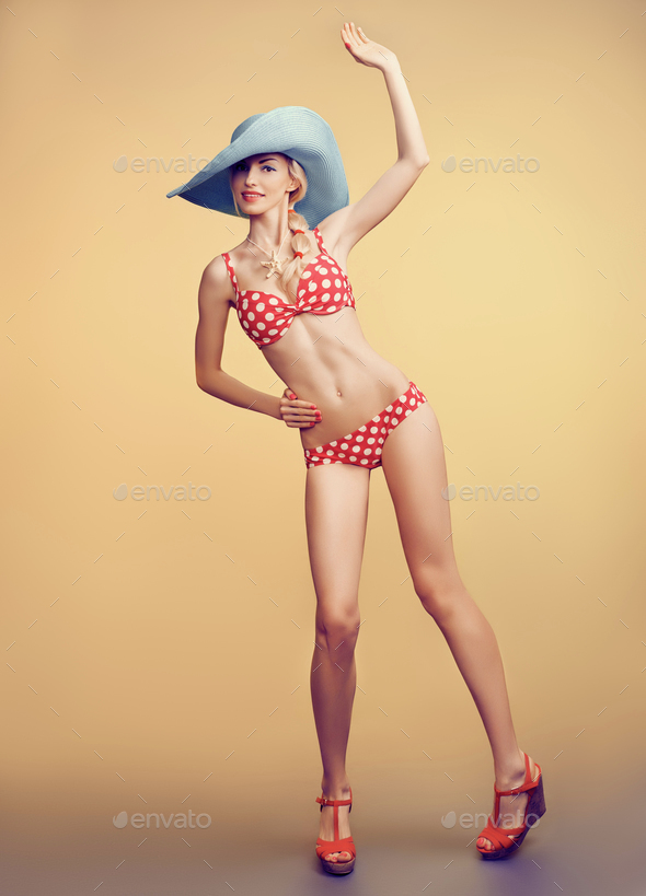 Sexy PinUp woman in polka dots swimsuit,beach body Stock Photo by